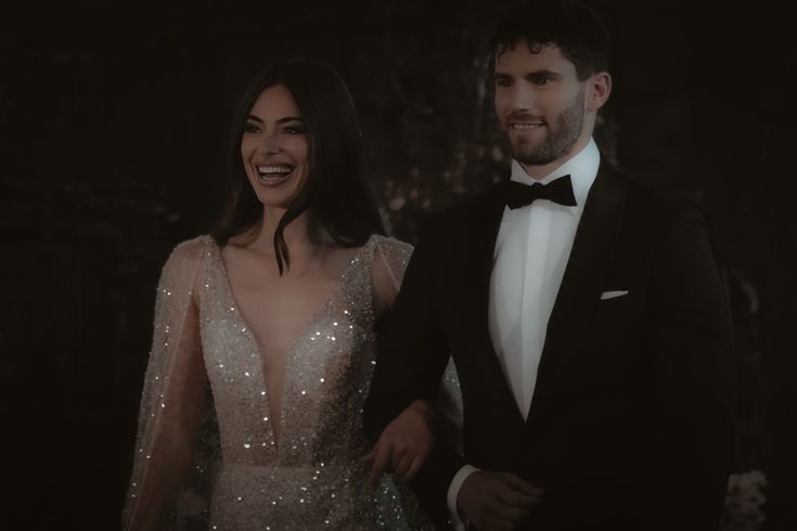 groom and bride holding arms