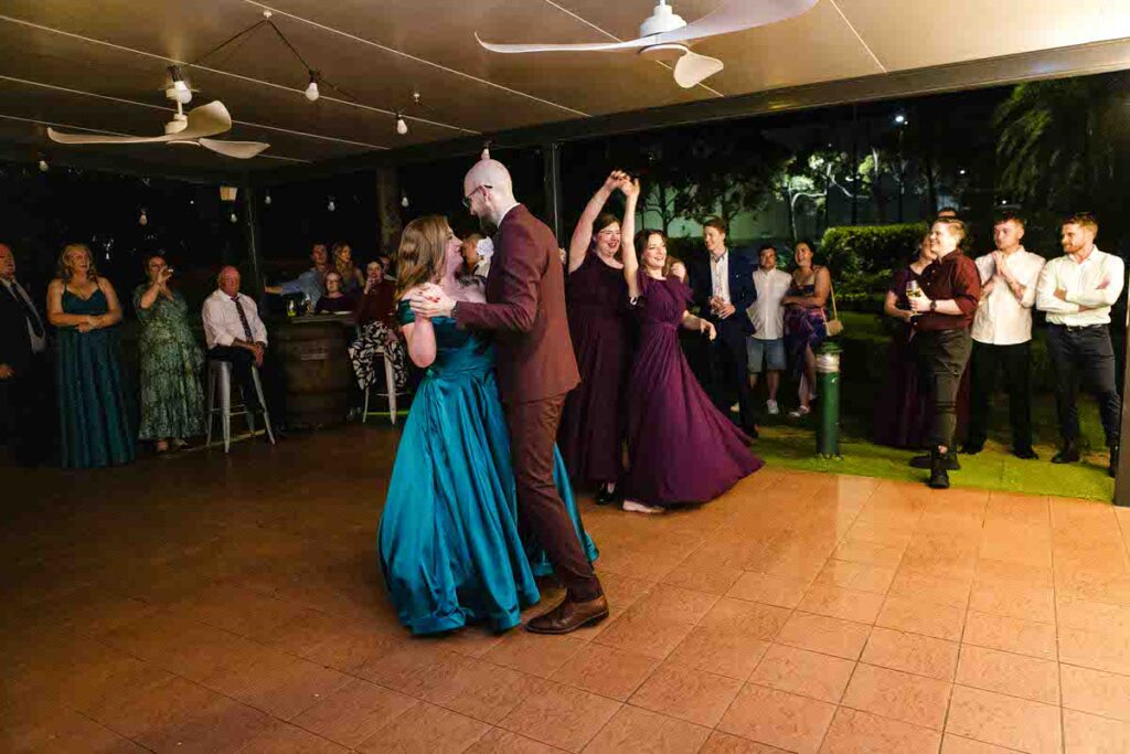 A wedding couple dancing at their reception